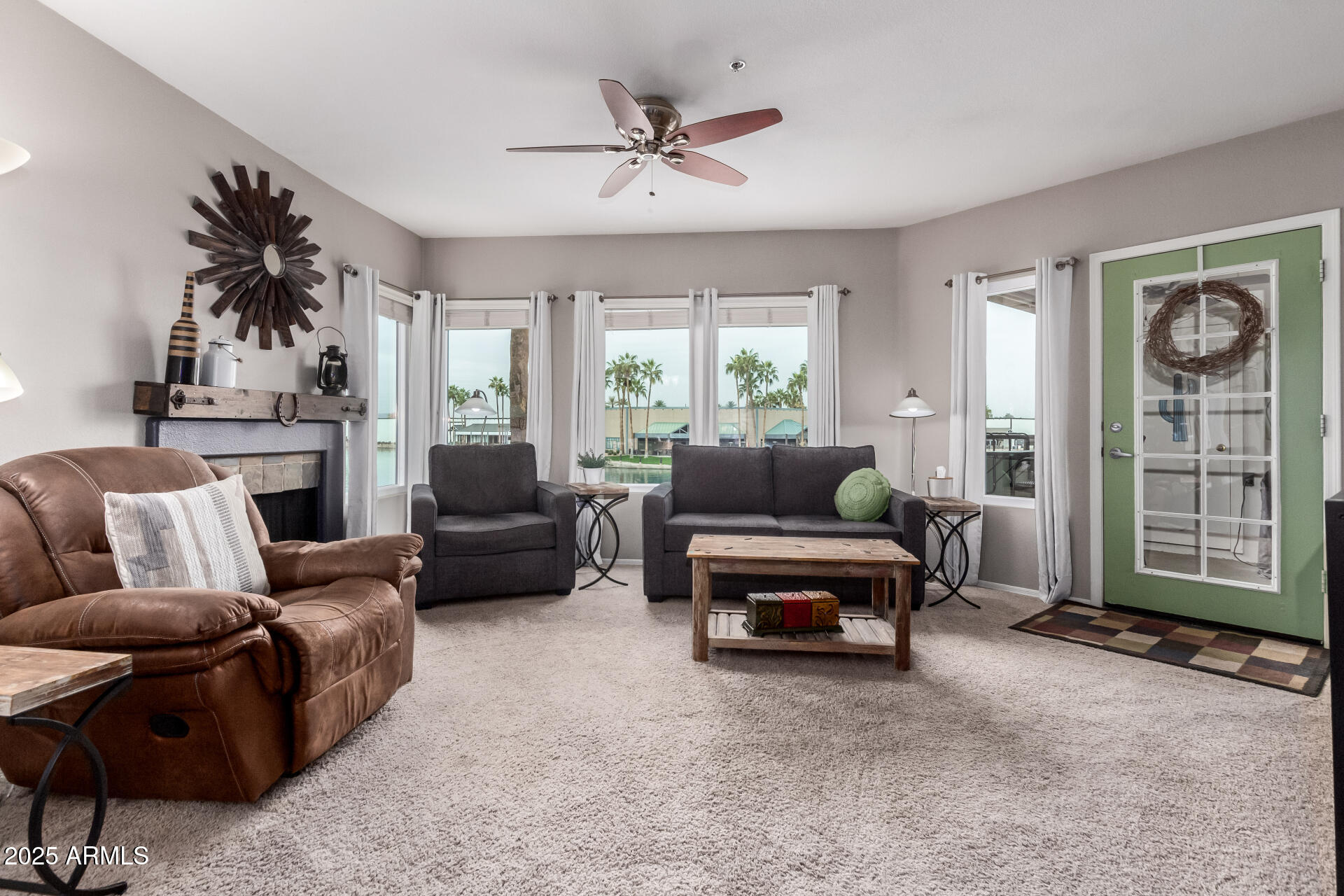 1825 West Ray Road, Unit 2116 Chandler, AZ 85224 - Photo 5 of 44 a living room with furniture and a large window