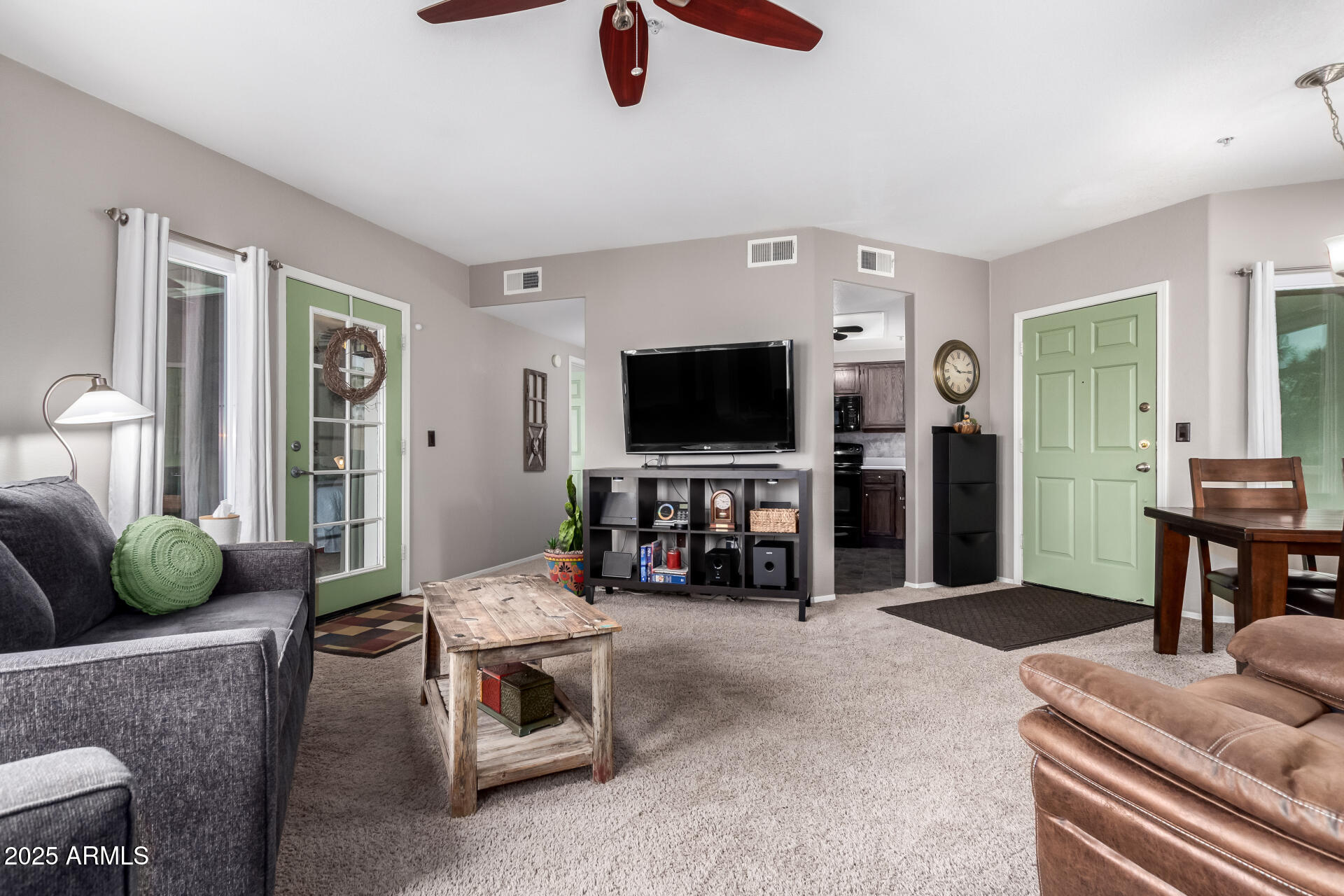1825 West Ray Road, Unit 2116 Chandler, AZ 85224 - Photo 6 of 44 a living room with furniture and a flat screen tv