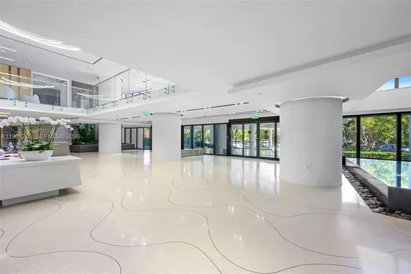 a view of an entryway with a floor to ceiling window