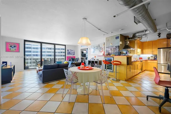 a living room with lots of furniture and a chandelier