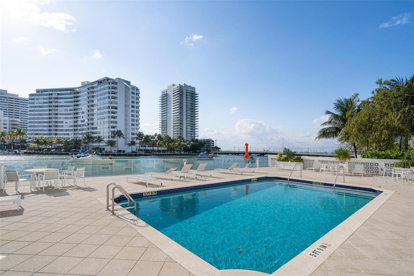 1450 Lincoln Road, Unit 403 Miami Beach, FL 33139 - Photo 21 of 21 a view of outdoor space with swimming pool and outdoor seating