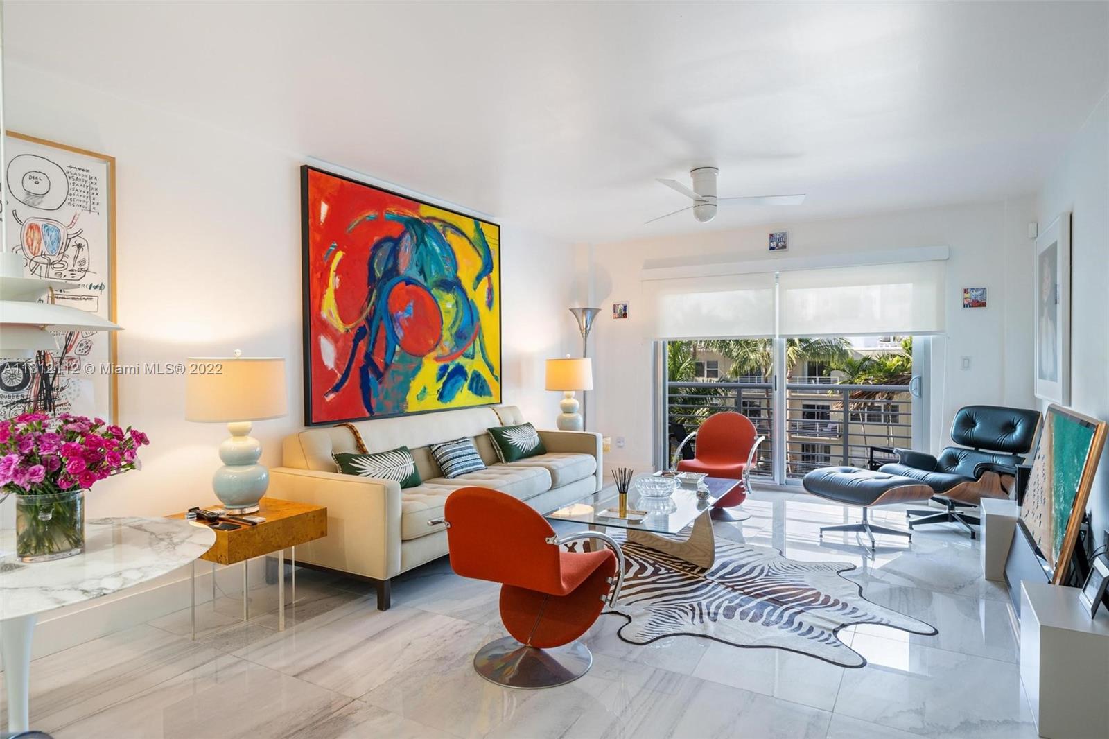 1450 Lincoln Road, Unit 403 Miami Beach, FL 33139 - Photo 4 of 21 a living room with furniture chess board and large window