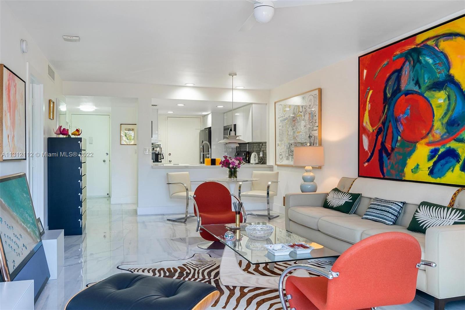 1450 Lincoln Road, Unit 403 Miami Beach, FL 33139 - Photo 5 of 21 a living room with furniture and kitchen view