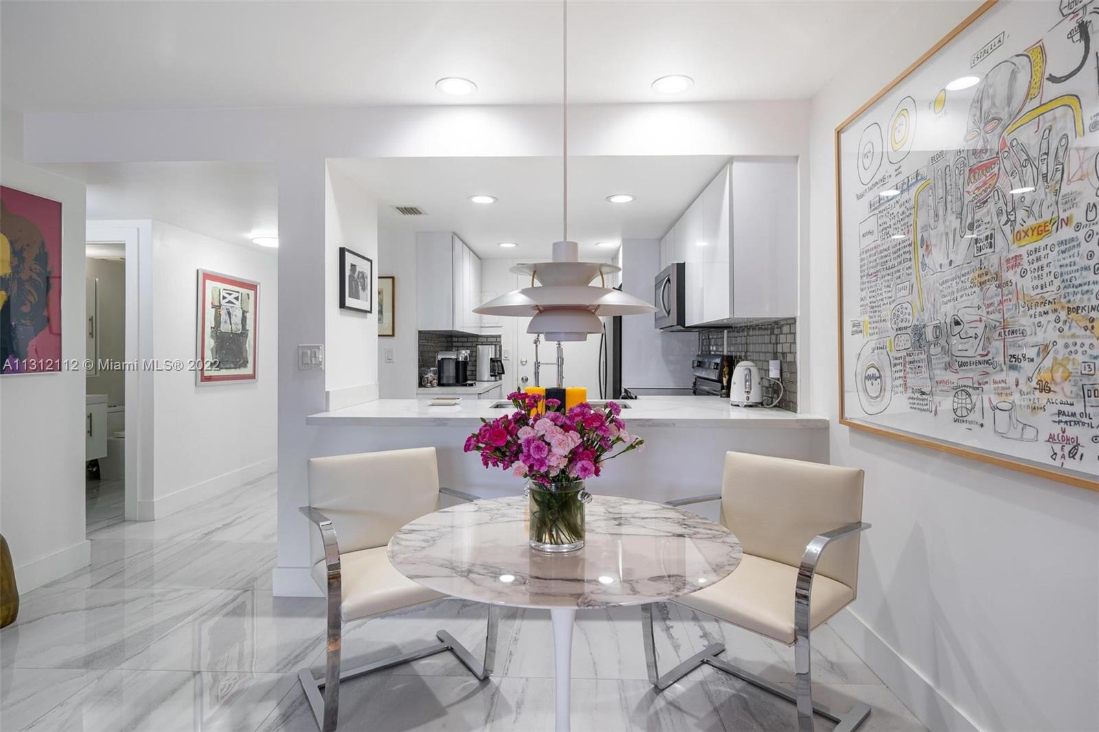 1450 Lincoln Road, Unit 403 Miami Beach, FL 33139 - Photo 8 of 21 a view of kitchen with furniture and chandelier