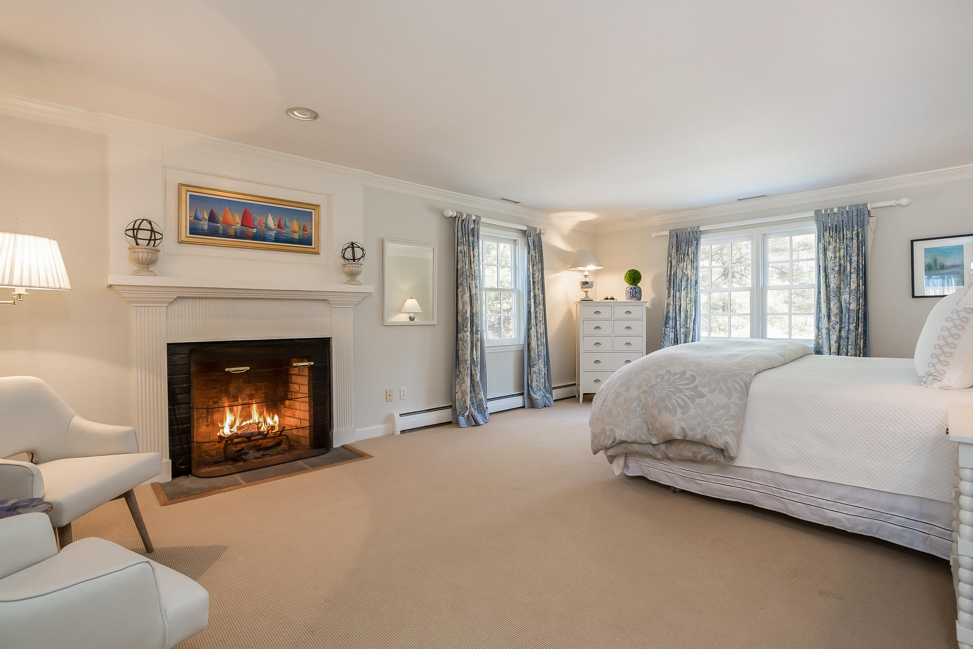 400 Middlesex Road Darien, CT 06820 - Photo 12 of 24 a spacious bedroom with a bed and a fireplace