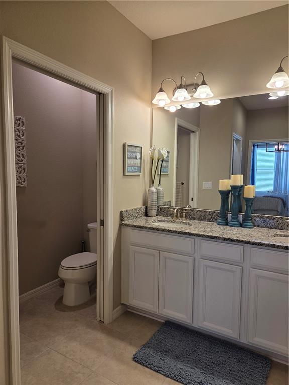 13703 Messina Loop, Unit 202 Bradenton, FL 34211 - Photo 17 of 42 a bathroom with a toilet sink and mirror