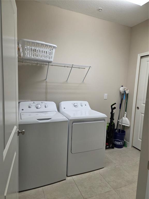 13703 Messina Loop, Unit 202 Bradenton, FL 34211 - Photo 22 of 42 a utility room with dryer and washer