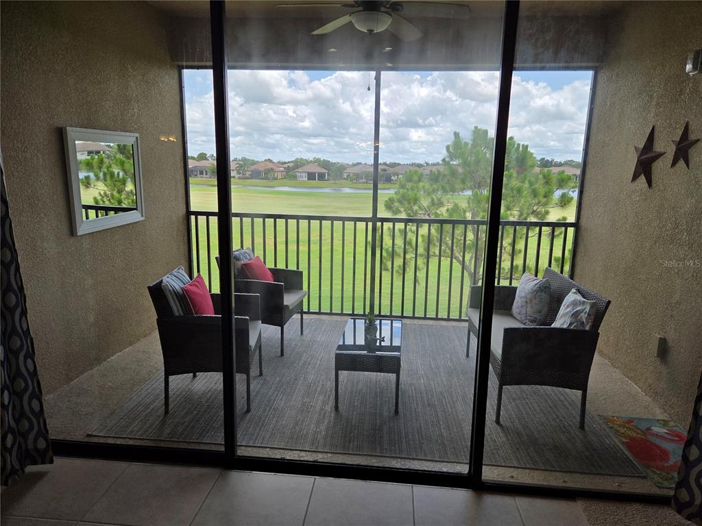 13703 Messina Loop, Unit 202 Bradenton, FL 34211 - Photo 23 of 42 a dining room with furniture window and outside view