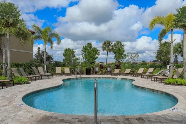 a view of a swimming pool with a patio