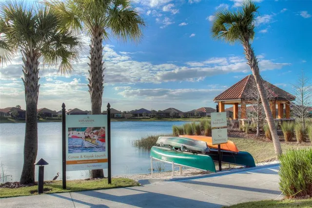a front view of a house with garden and patio