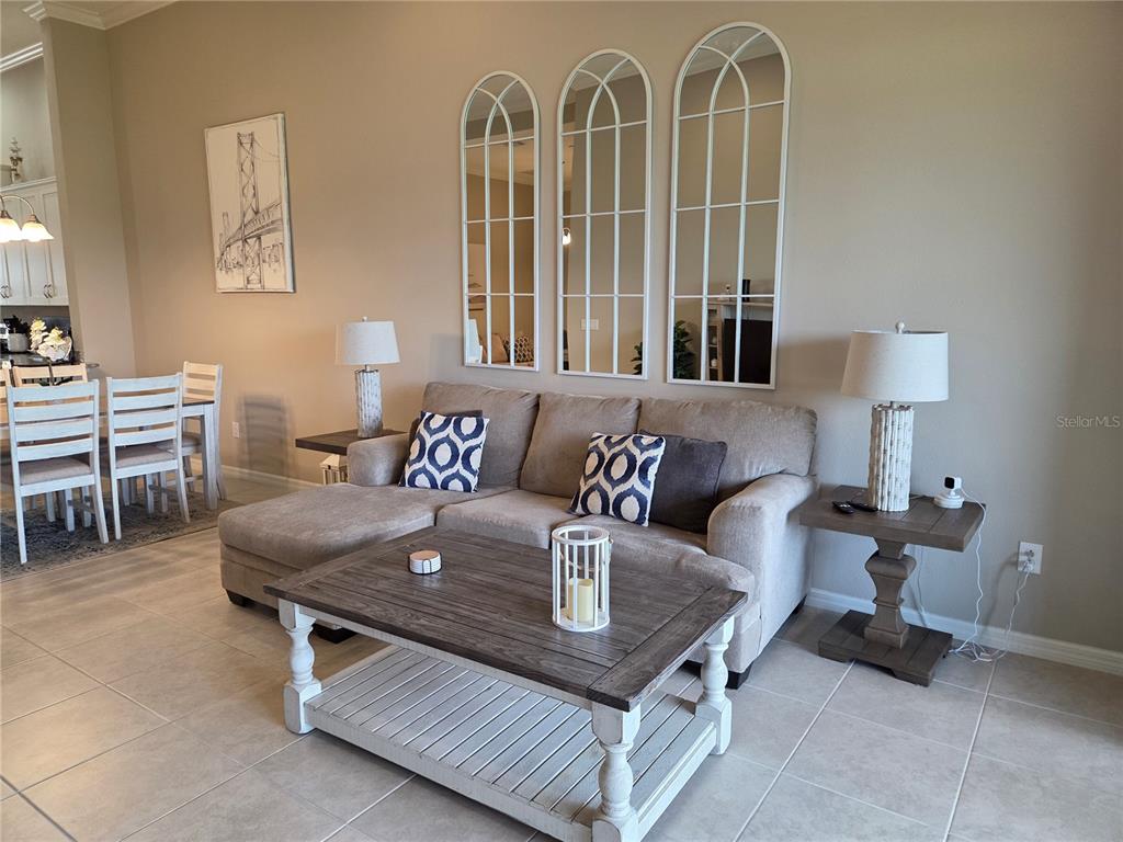 13703 Messina Loop, Unit 202 Bradenton, FL 34211 - Photo 6 of 42 a living room with furniture and a window