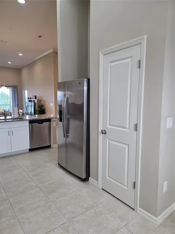 a kitchen with a refrigerator and a sink