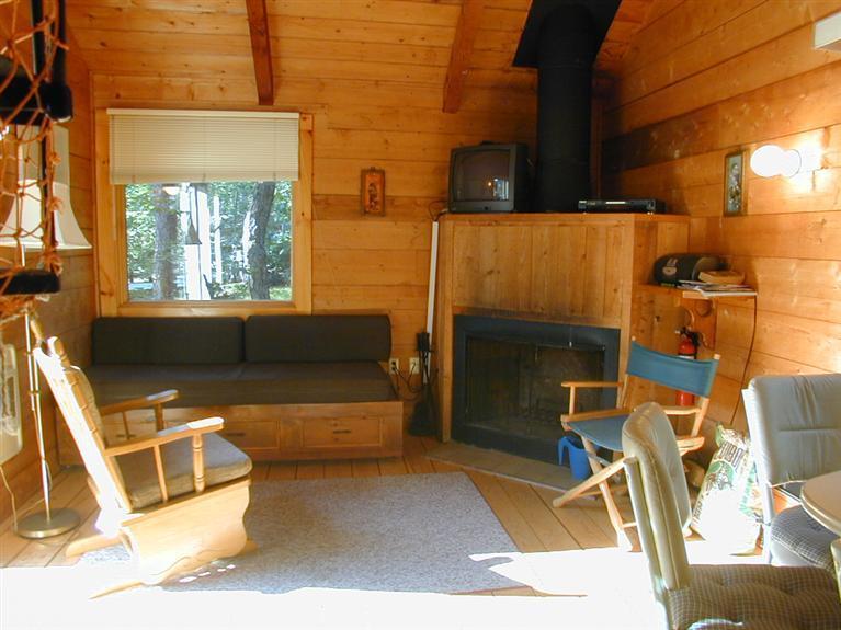 106 Cottontail Road, Unit A3 Wellfleet, MA 02667 - Photo 1 of 14 a building outdoor space with patio furniture and a fireplace