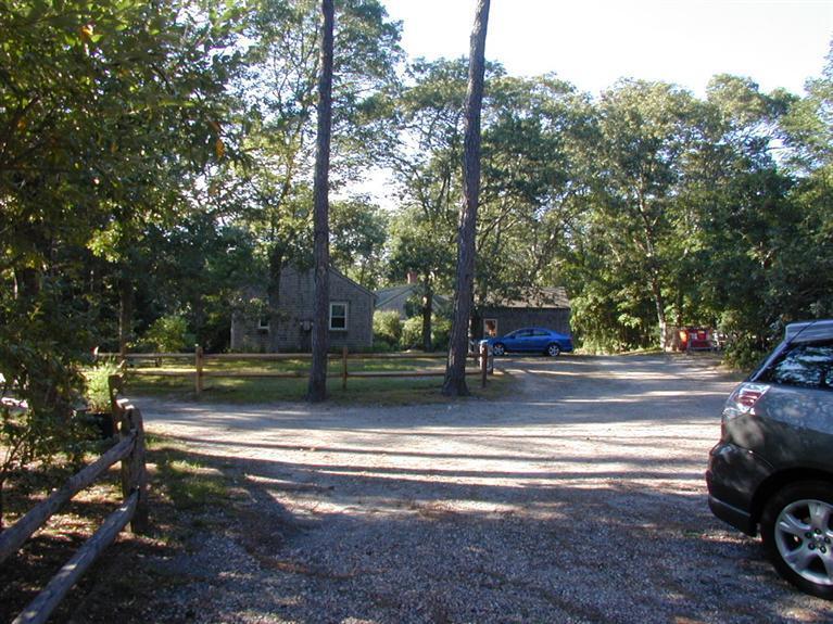 106 Cottontail Road, Unit A3 Wellfleet, MA 02667 - Photo 12 of 14 a view of a house with a yard