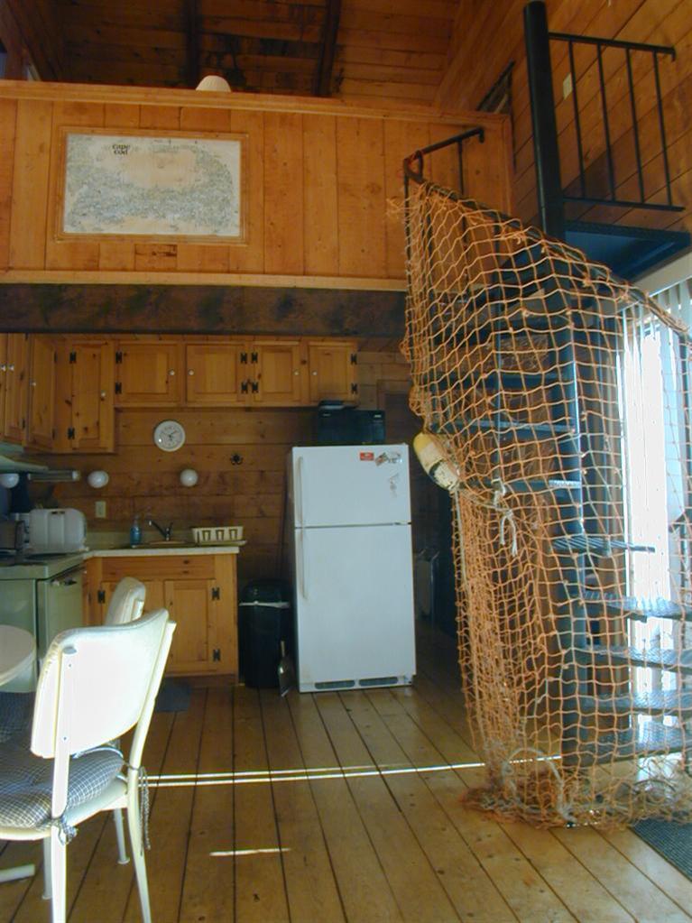 106 Cottontail Road, Unit A3 Wellfleet, MA 02667 - Photo 5 of 14 a view of a patio with open kitchen