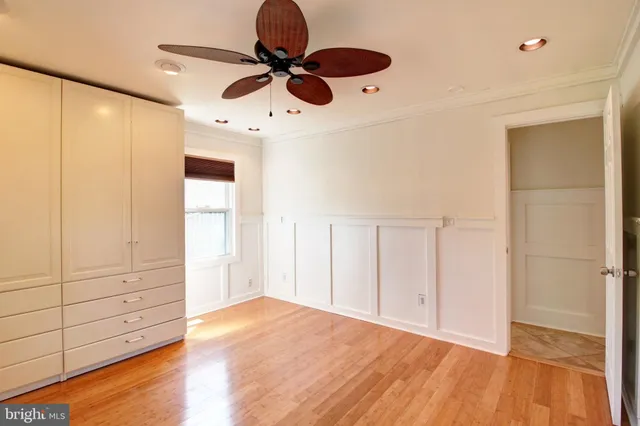 a view of an empty room and wooden floor