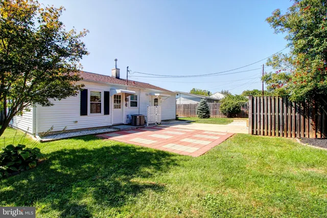a front view of a house with yard and porch