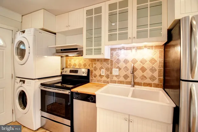 a utility room with dryer and washer