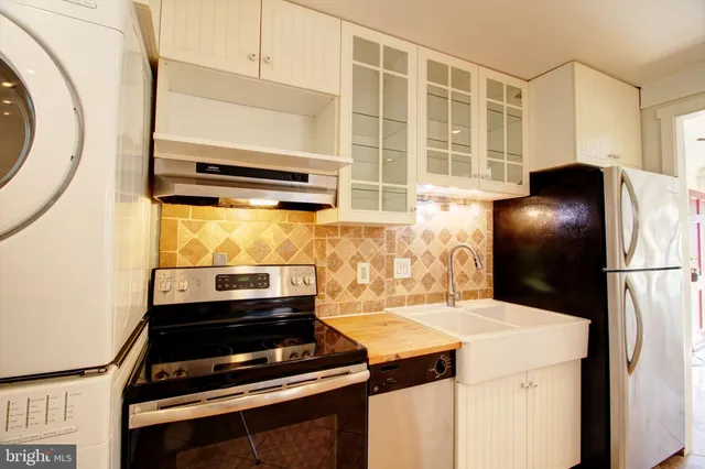 a kitchen with a stove and a refrigerator