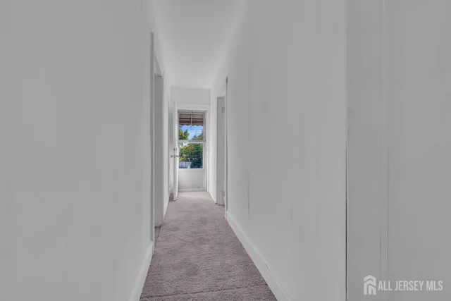 a yellow and red sign sitting on the side of a street