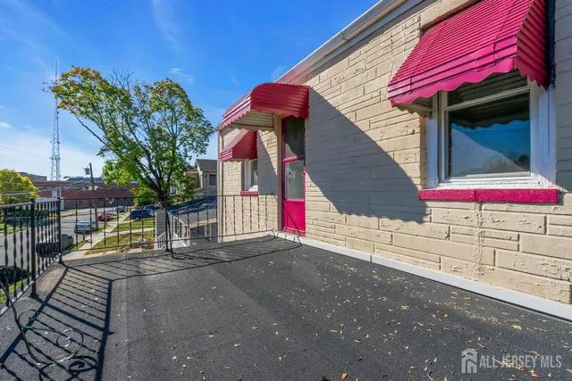 a view of empty room with wooden walls