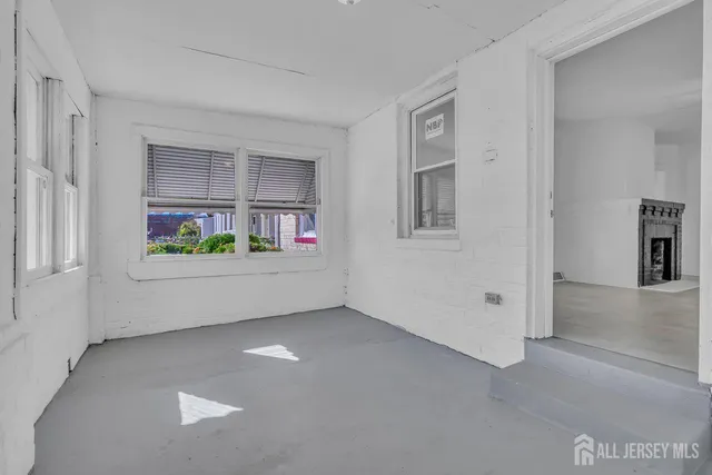 an empty room with windows and way