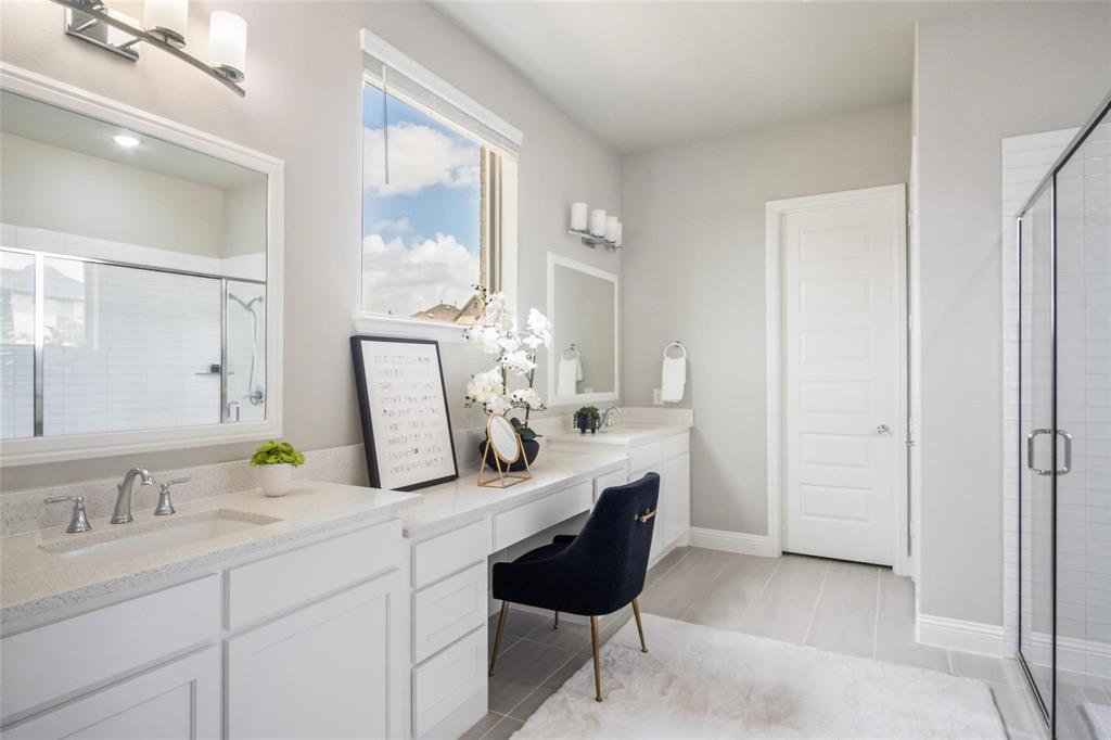 7411 Joshua Road Frisco, TX 75033 - Photo 14 of 40 a bathroom with a granite countertop sink a toilet and a mirror