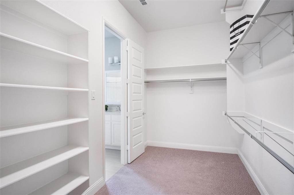 7411 Joshua Road Frisco, TX 75033 - Photo 18 of 40 a view of an empty walk in closet