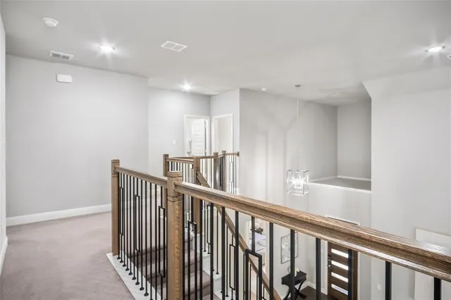 an empty room with a window and ceiling fan