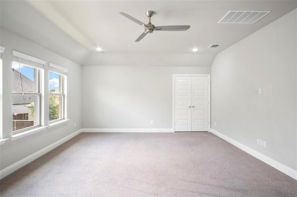 7411 Joshua Road Frisco, TX 75033 - Photo 26 of 40 an empty room with a window and ceiling fan