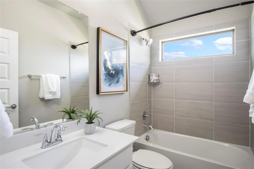 7411 Joshua Road Frisco, TX 75033 - Photo 29 of 40 a bathroom with a sink toilet and shower