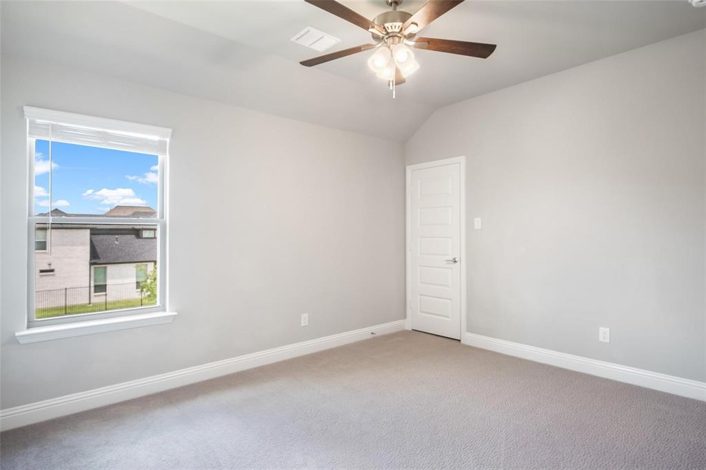 7411 Joshua Road Frisco, TX 75033 - Photo 33 of 40 an empty room with a window and a fan