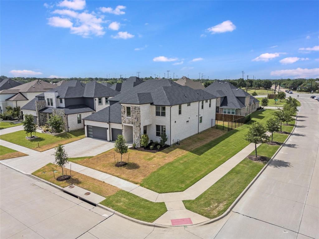 7411 Joshua Road Frisco, TX 75033 - Photo 39 of 40 a view of a house with swimming pool and a yard