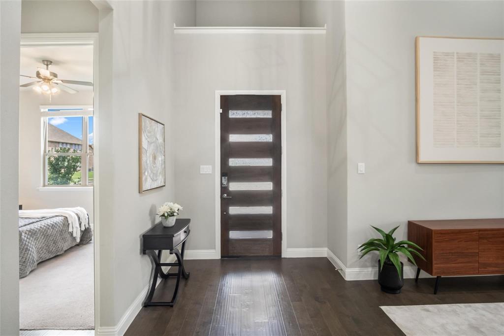 7411 Joshua Road Frisco, TX 75033 - Photo 4 of 40 a view of a livingroom with furniture and a couch