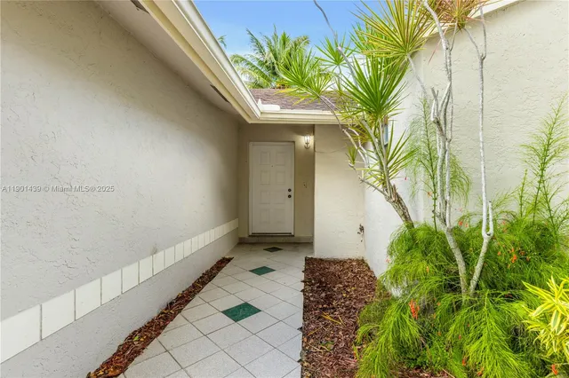 a view of a livingroom with furniture and a flat screen tv