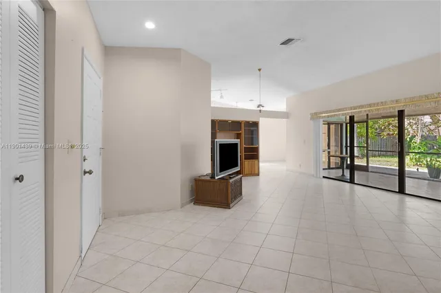 a view of an empty room with a fireplace