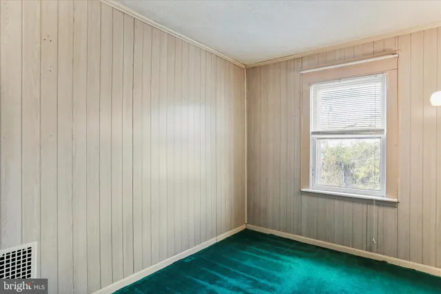 a view of a hallway with seating area