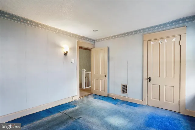 a view of a balcony with wooden fence