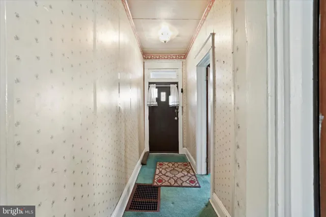 a view of entryway with wooden walls