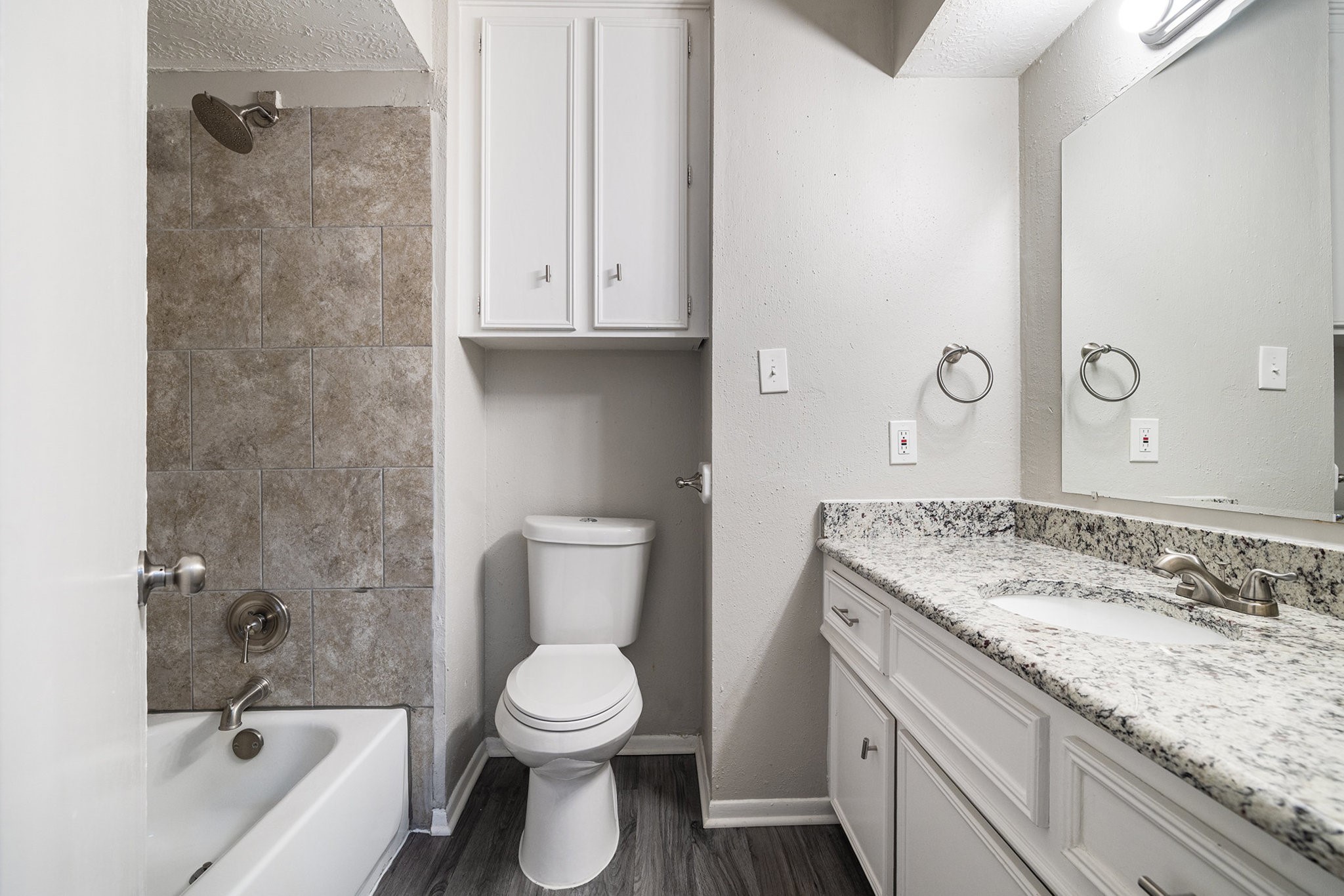 29118 Raestone Street Spring, TX 77386 - Photo 13 of 21 a bathroom with a granite countertop toilet sink and mirror