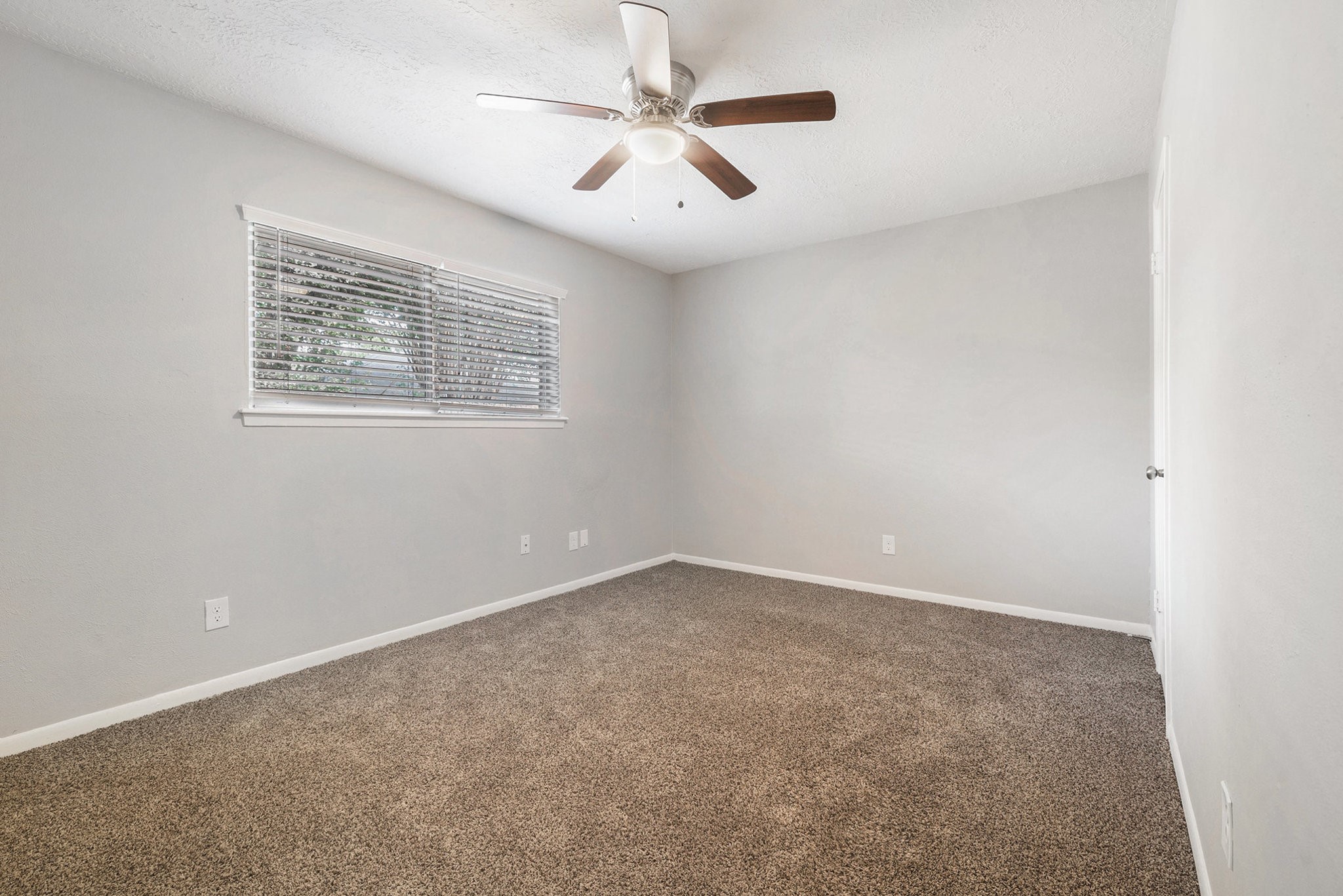 29118 Raestone Street Spring, TX 77386 - Photo 17 of 21 an empty room with a window and a ceiling fan