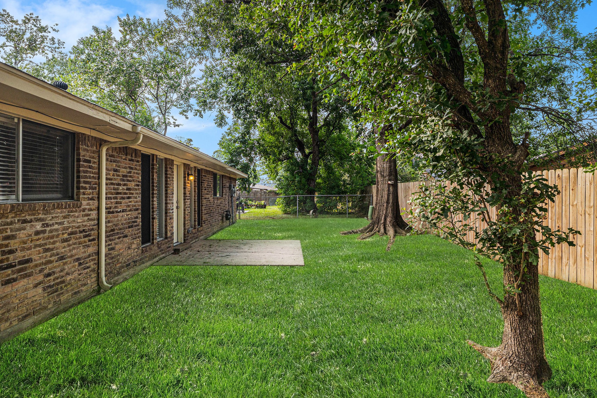 29118 Raestone Street Spring, TX 77386 - Photo 20 of 21 a view of a backyard with large trees