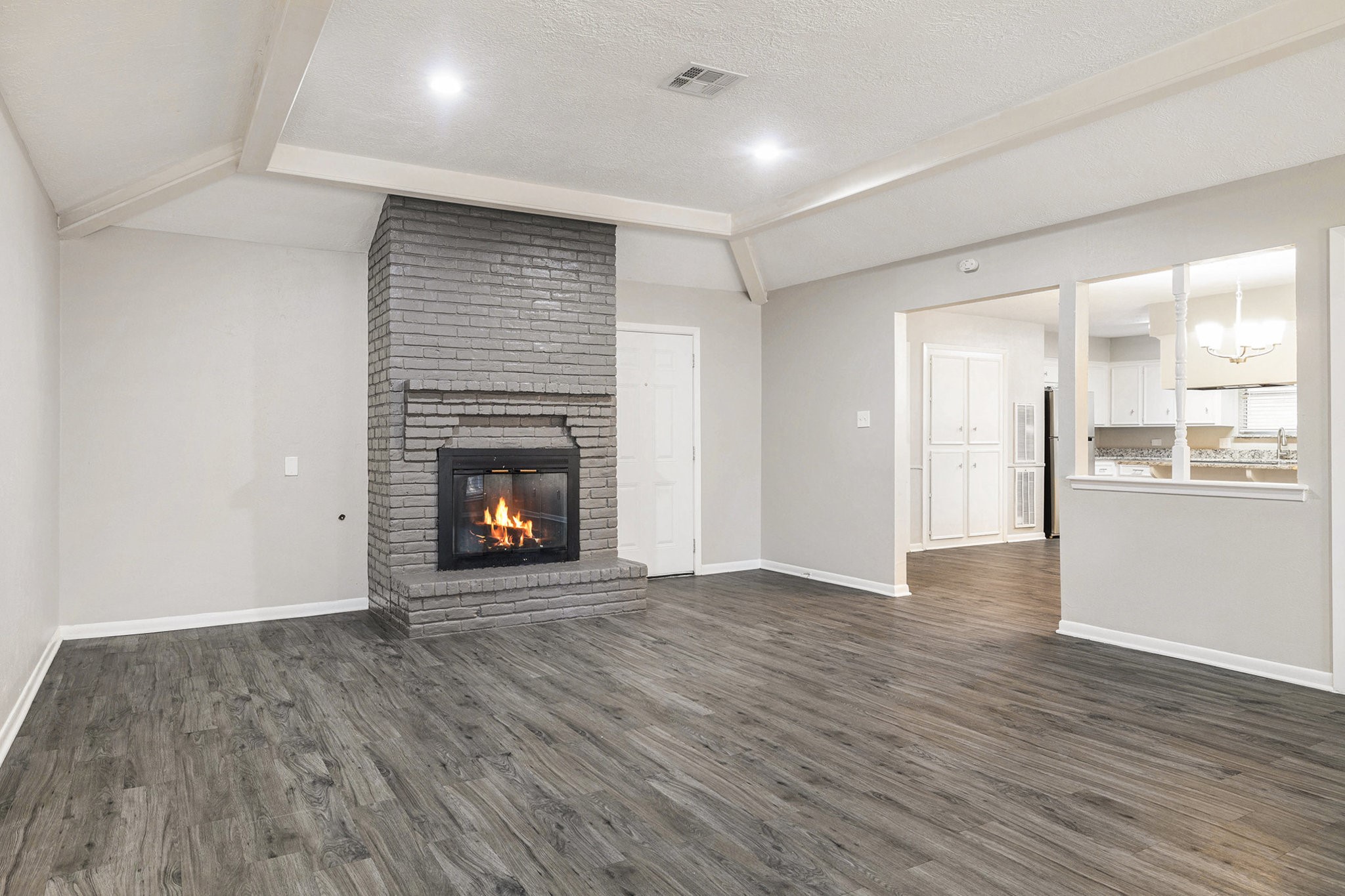 29118 Raestone Street Spring, TX 77386 - Photo 6 of 21 a view of an empty room with a fireplace and a window