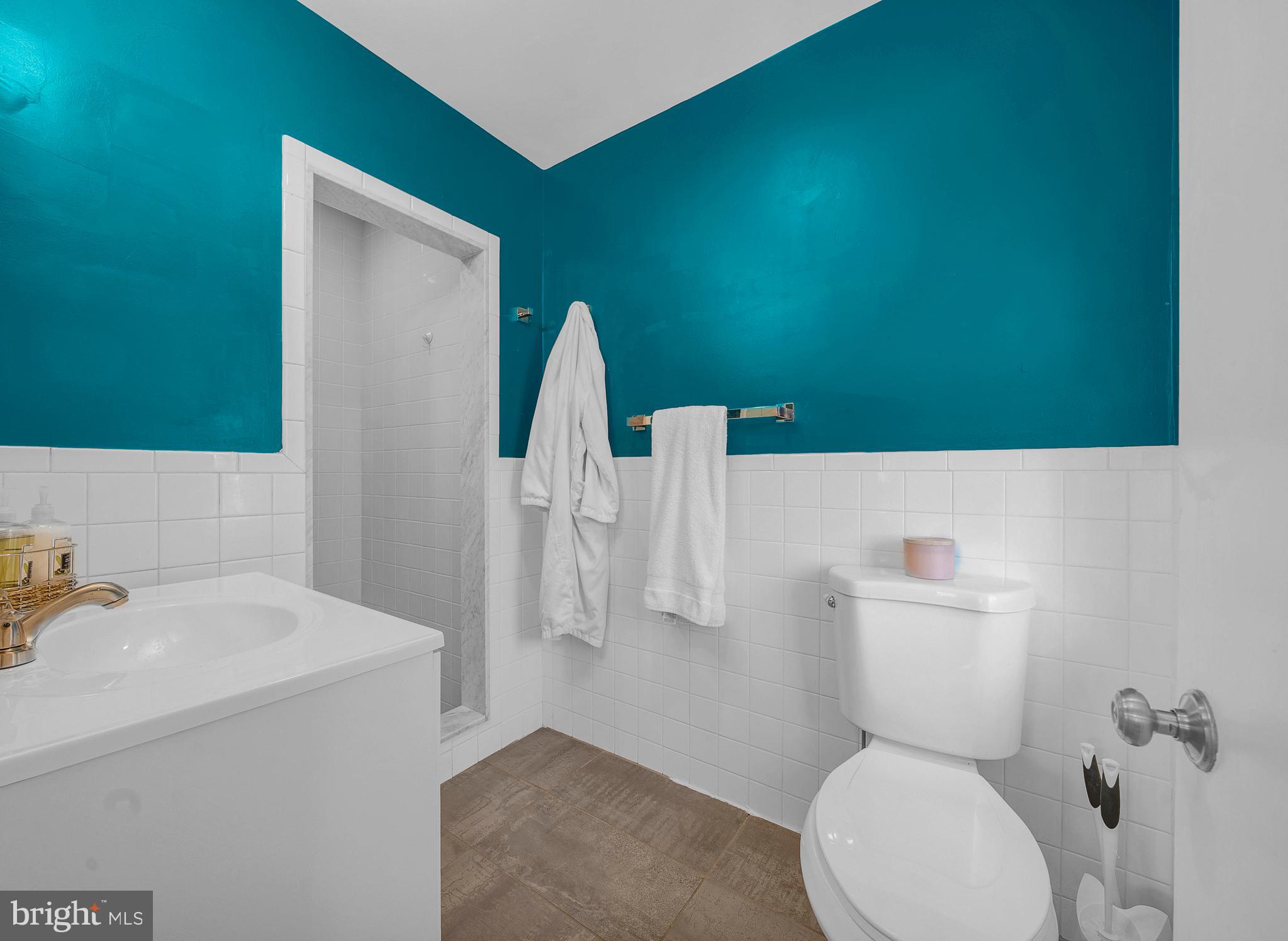 307 Washington Lane Fort Washington, PA 19034 - Photo 20 of 32 a bathroom with a toilet sink and mirror