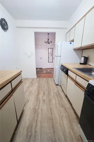 a bathroom with a toilet a sink and bathtub