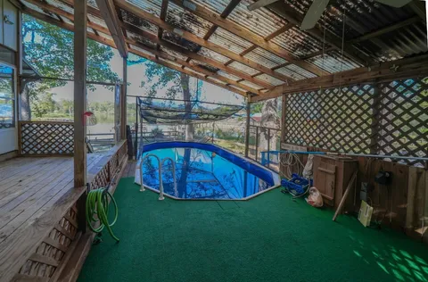 a view of a backyard with a deck