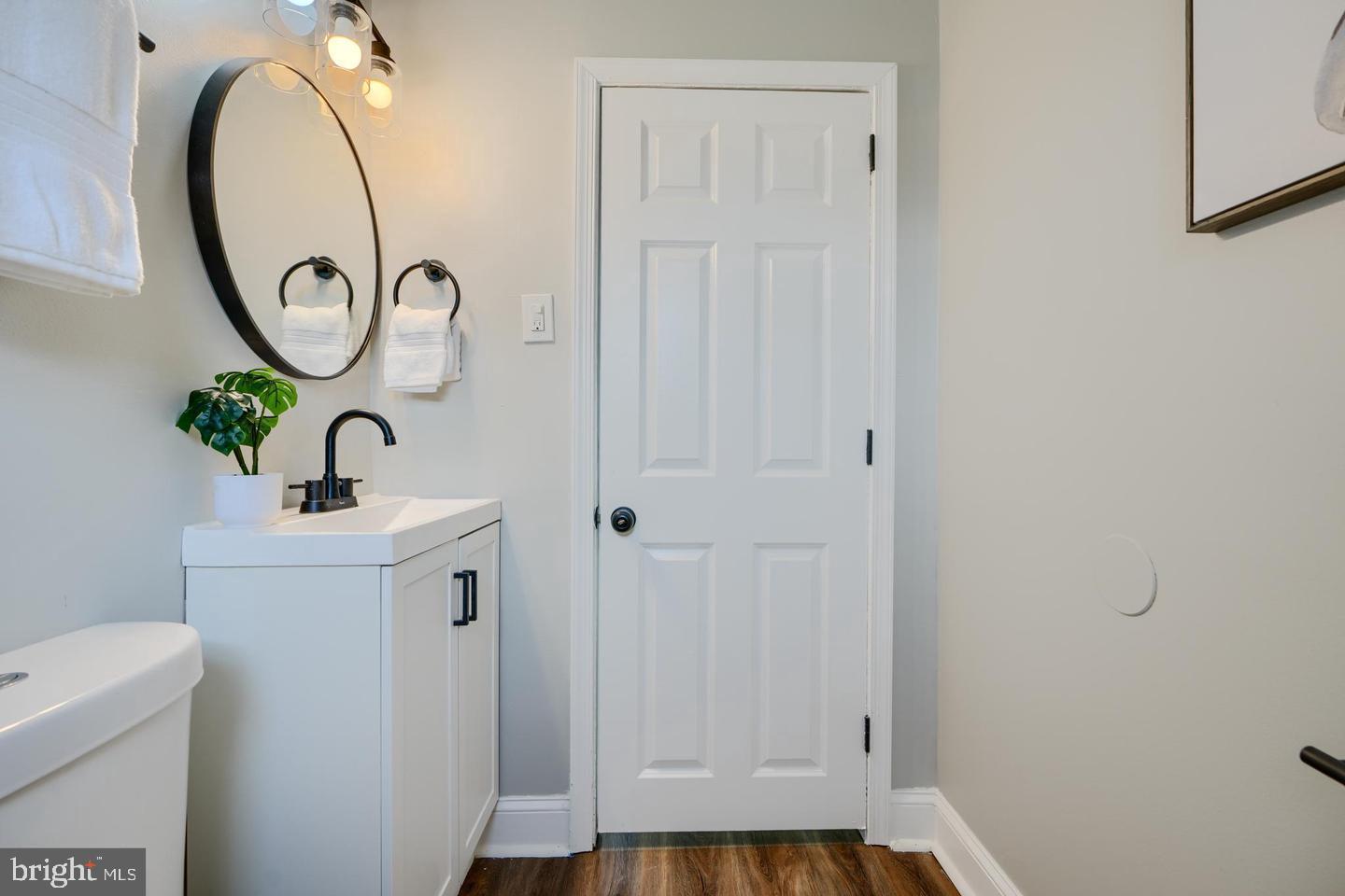 1944 Quentin Road Dundalk, MD 21222 - Photo 14 of 41 a bathroom with a sink and a mirror