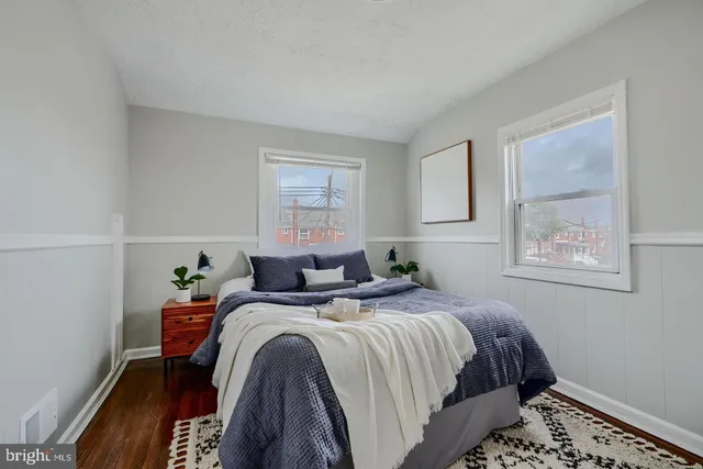 a bedroom with bed and window