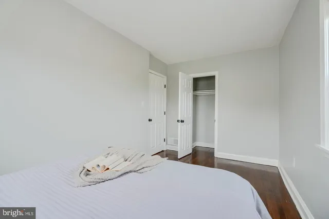 a bedroom with a bed and a cabinets