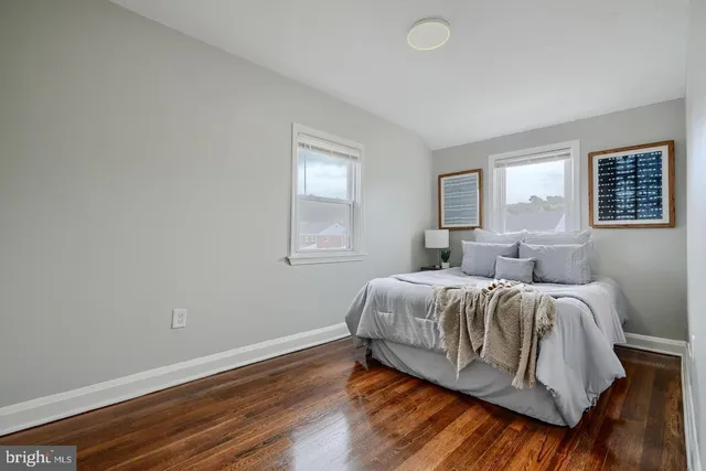 a spacious bedroom with a bed and window